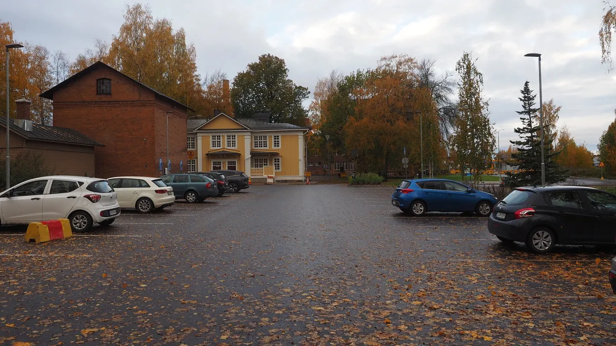 A view of a parking lot in Hiedanranta, Tampere, Finland near the Lielahti Manor on a morning in October 2024.