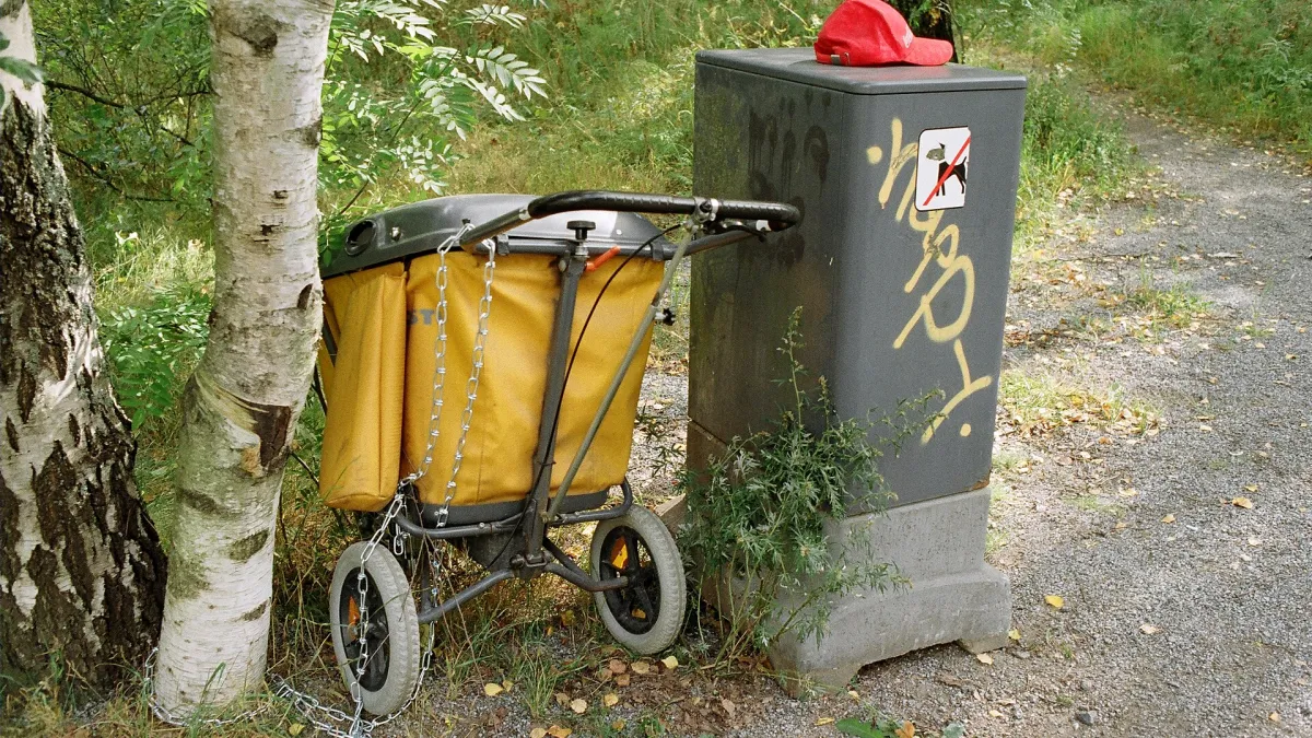 A mail cart and a box for temporarily storing bundles of daily mail. Tesoma, Tampere, Finland.