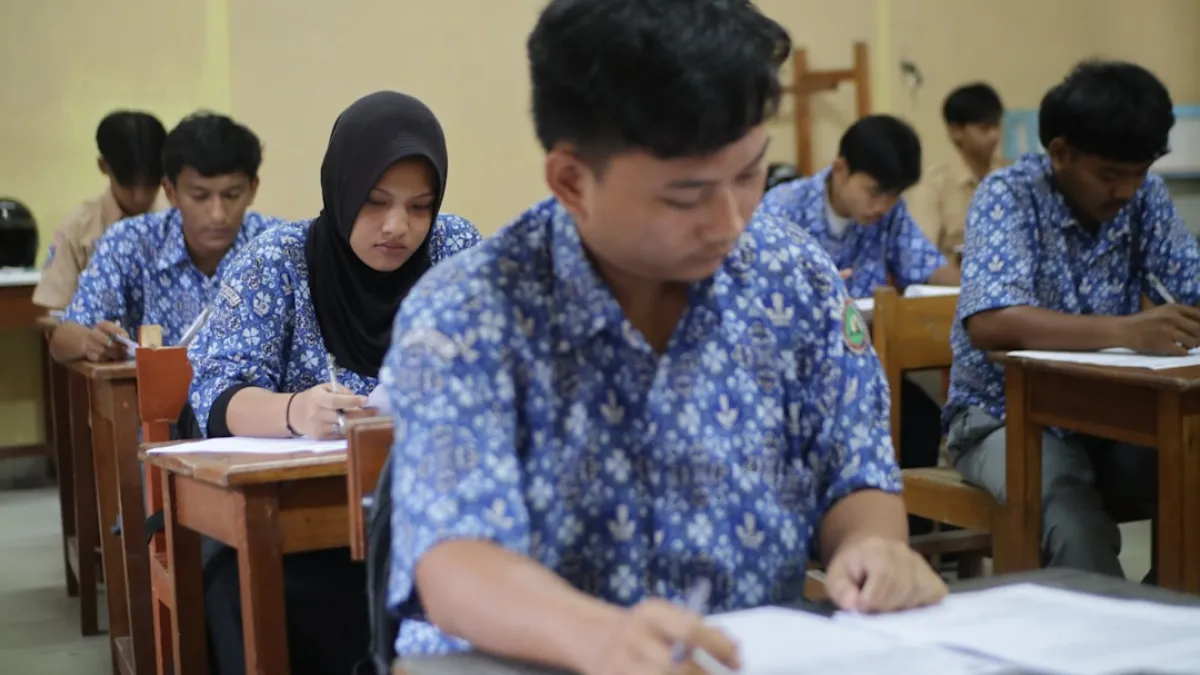 Students are taking a test in a classroom