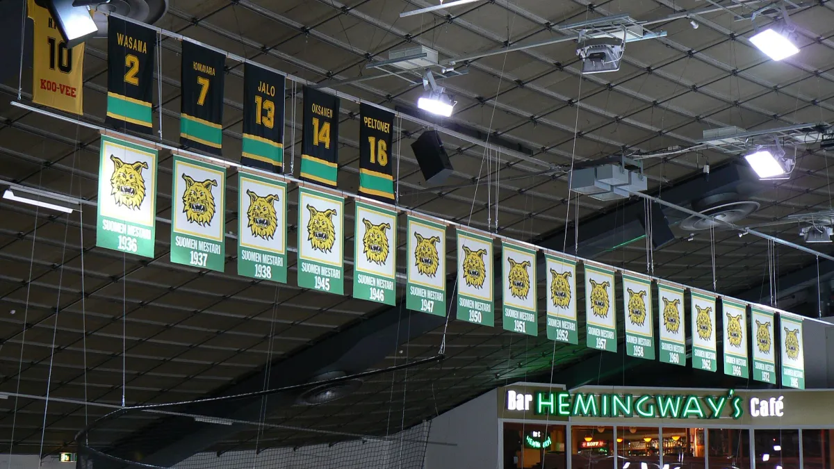 Banners commemorating championships won and player numbers retired by the Finnish ice hockey club Ilves Tampere, at the Hakametsä hockey arena.