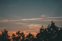Sunlit Aircraft Contrail Explains Red Streak Over Tampere
