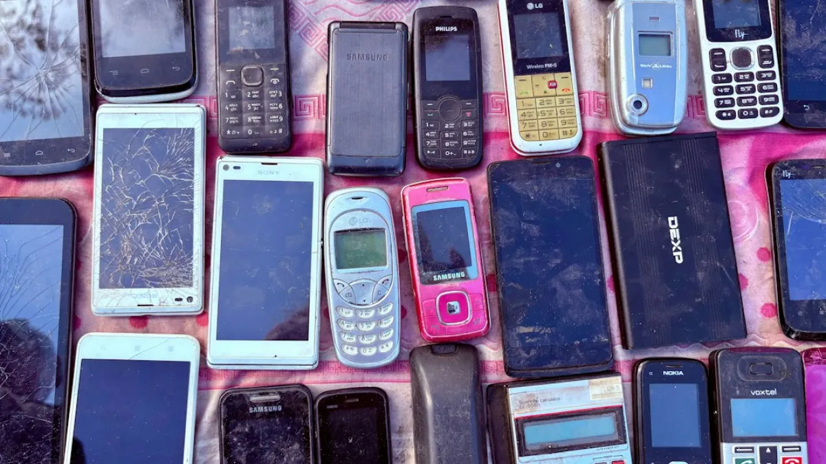 A collection of various old mobile phones and devices