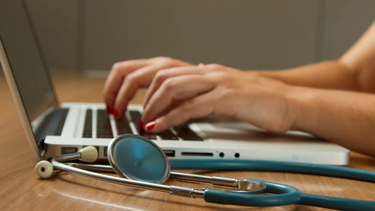 Stethoscope and Laptop Computer. Laptop computers and other kinds of mobile devices and communications technologies are of increasing importance in the delivery of health care. Photographer Daniel Sone  