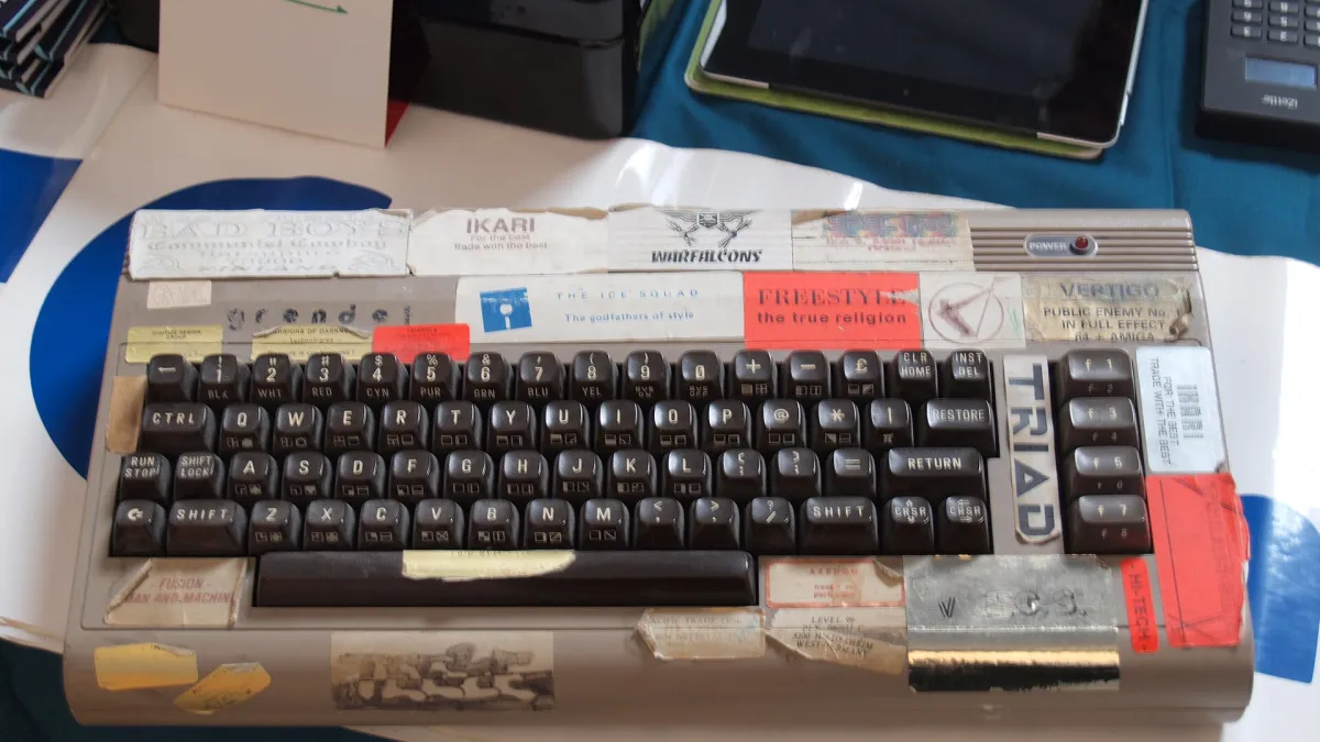 A genuine demoscene Commodore 64, a middle 1980s home computer used for many years for writing articles, playing games, watching demos, writing demos, writing graphics (yes, people wrote graphics rather than drew it in those days), copying software, making disk magazines and other stuff. It is apparently still in perfect working order. Owned by Jukka O. Kauppinen (Grendel / Byterapers). Photographed at the annual SAKU meeting in the Tampere central library Metso in Tampere, Pirkanmaa, Finland in September 2014.
