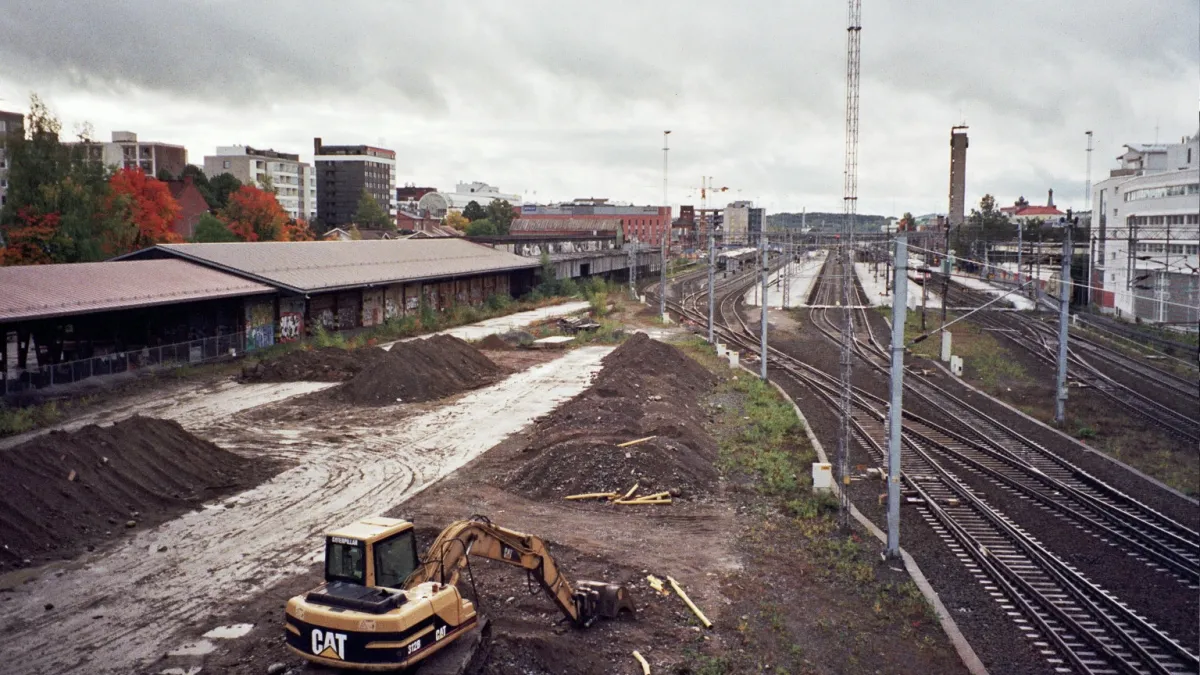 A part of the railyard at the railway station of Tampere in Finland. The wooden warehouses on the left were demolished in August–September 2009.