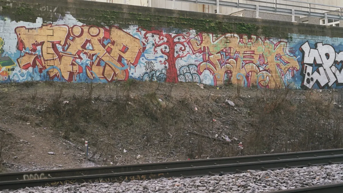Graffiti alongside the Tampere-Seinäjoki railway in the Santalahti district of Tampere, Finland.