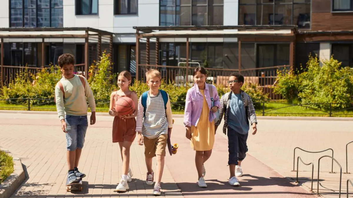 A diverse group of children walking outdoors, symbolizing friendship and multicultural unity.