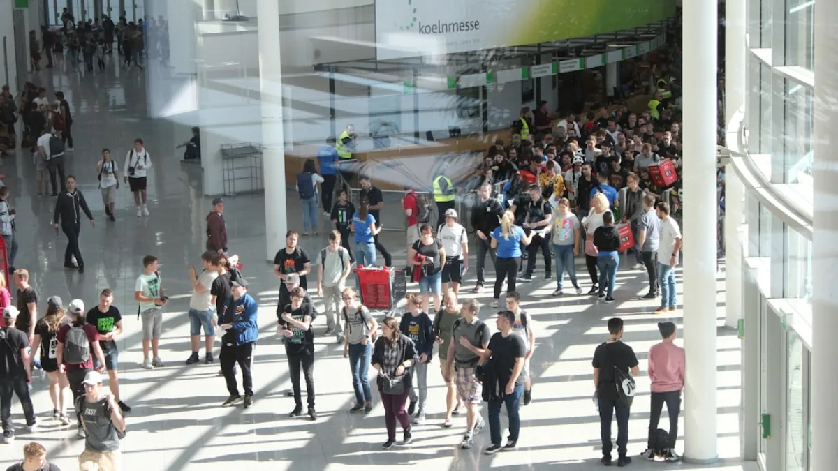 Young people entering Gamescom 2019 shot from an elevated position